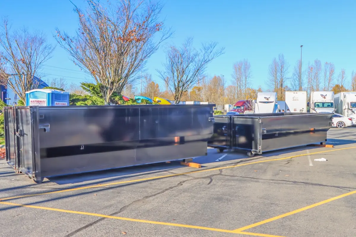 Professional dumpster rental service with roll-off container on residential driveway in Skiatook